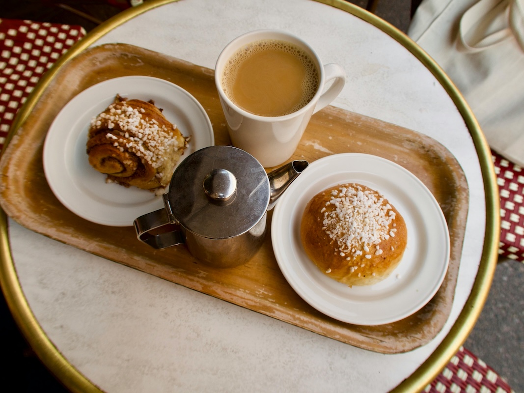 Swedish fika table with coffee, cinnamon buns, and pastries – the heart of Swedish coffee culture